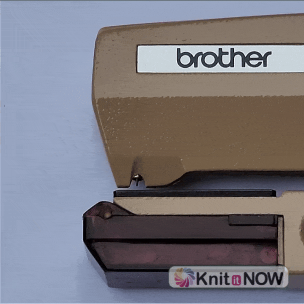 Animated GIF showing the small alignment (guide) pin on a punchcard punch tool moving in and out for hole positioning